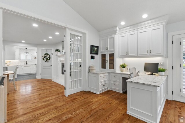 15 S 300 E, Payson, UT 84651 - kitchen with built in study area, white cabinets, wood finished floors, and vaulted ceiling
