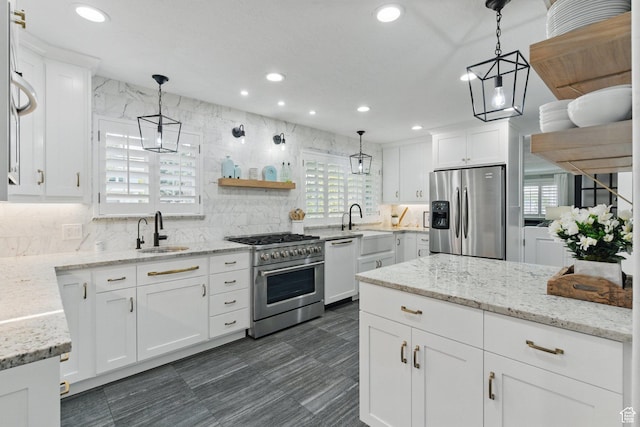 15 S 300 E, Payson, UT 84651 - kitchen featuring recessed lighting, a sink, white cabinets, and stainless steel appliances