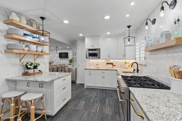 15 S 300 E, Payson, UT 84651 - kitchen with open shelves, a sink, tasteful backsplash, and stainless steel appliances