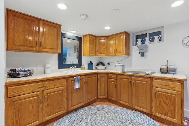 15 S 300 E, Payson, UT 84651 - kitchen with a sink, light countertops, brown cabinetry, and black electric cooktop