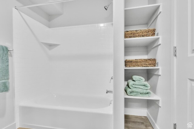 1140 W 950 N Unit E202, Orem, UT 84057 - full bath with baseboards, shower / bathtub combination, and wood finished floors