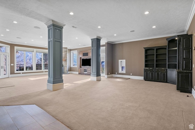 unfurnished living room with decorative columns, recessed lighting, and light colored carpet