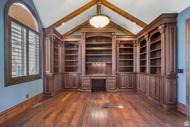 interior space featuring visible vents, built in study area, baseboards, dark wood finished floors, and vaulted ceiling