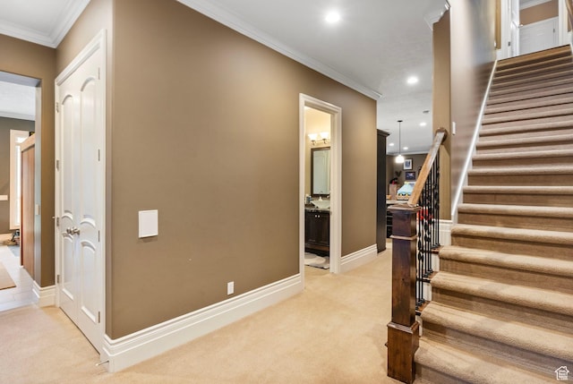 stairs featuring recessed lighting, baseboards, ornamental molding, and carpet