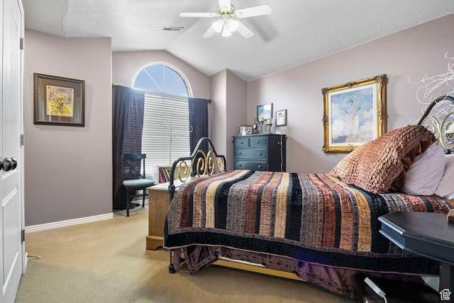 bedroom featuring ceiling fan, carpet floors, baseboards, lofted ceiling, and visible vents