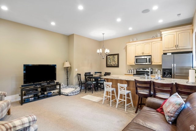 living area featuring light carpet, a chandelier, recessed lighting, baseboards, and visible vents