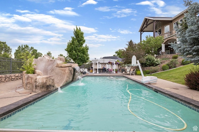 view of swimming pool with fence, a fenced in pool, and a patio area