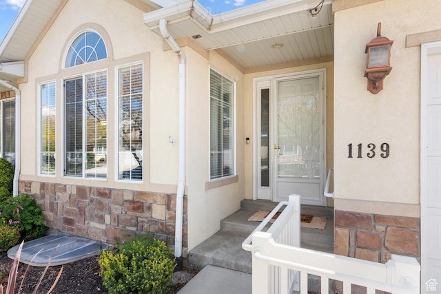 1139 Grainery Cv, Riverton, UT 84065 - doorway to property featuring stone siding and stucco siding