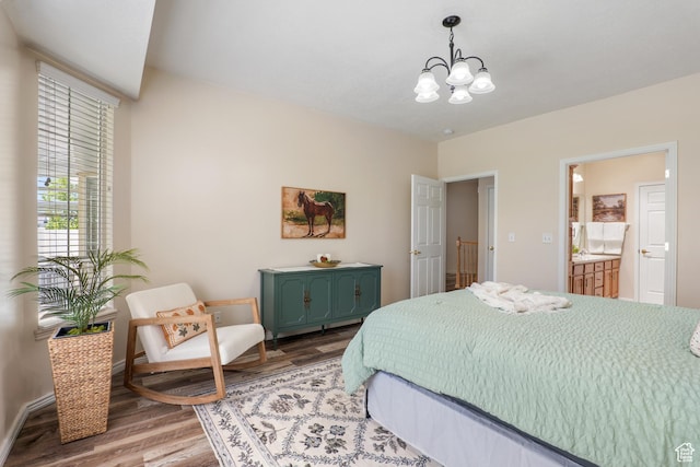 1139 Grainery Cv, Riverton, UT 84065 - bedroom featuring baseboards, a chandelier, wood finished floors, and ensuite bath