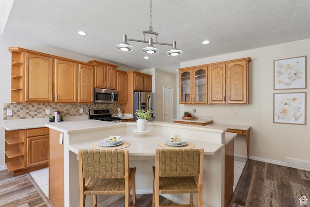 1139 Grainery Cv, Riverton, UT 84065 - kitchen featuring light countertops, appliances with stainless steel finishes, open shelves, and a kitchen island