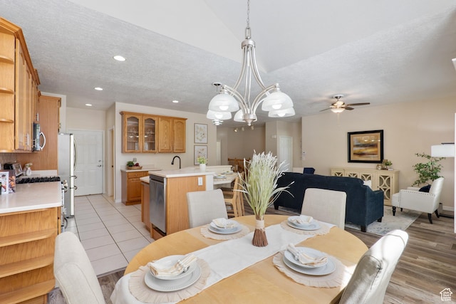 1139 Grainery Cv, Riverton, UT 84065 - dining area featuring a textured ceiling, baseboards, ceiling fan with notable chandelier, recessed lighting, and light wood-style flooring