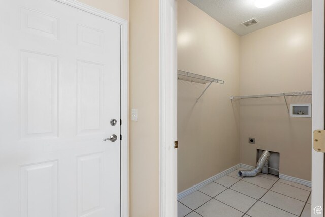 1139 Grainery Cv, Riverton, UT 84065 - washroom featuring washer hookup, hookup for an electric dryer, laundry area, baseboards, and light tile patterned flooring
