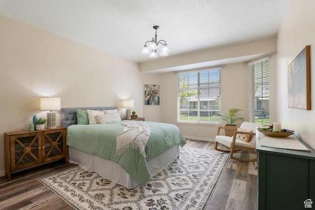 1139 Grainery Cv, Riverton, UT 84065 - bedroom featuring baseboards, an inviting chandelier, and wood finished floors