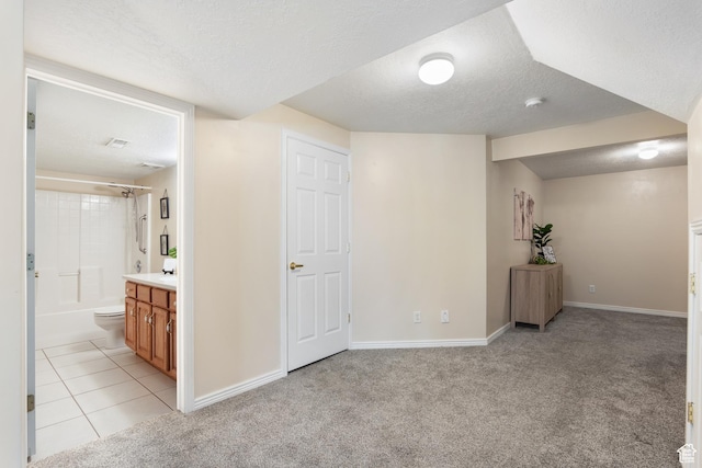 1139 Grainery Cv, Riverton, UT 84065 - basement featuring baseboards, a textured ceiling, and light carpet