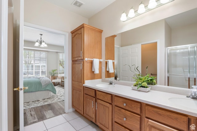 1139 Grainery Cv, Riverton, UT 84065 - ensuite bathroom with a sink, tile patterned floors, double vanity, and visible vents