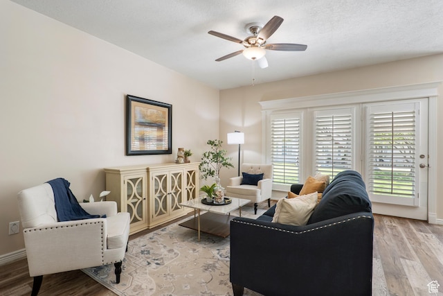 1139 Grainery Cv, Riverton, UT 84065 - living room with a ceiling fan, baseboards, a wealth of natural light, and light wood-style flooring