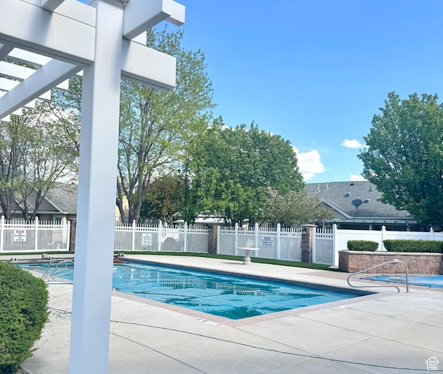 1139 Grainery Cv, Riverton, UT 84065 - community pool featuring a patio and fence