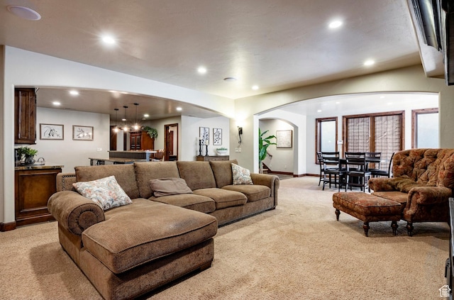 8777 S Falcon Heights Ln E, Cottonwood Heights, UT 84093 - living room featuring arched walkways, baseboards, light carpet, and recessed lighting