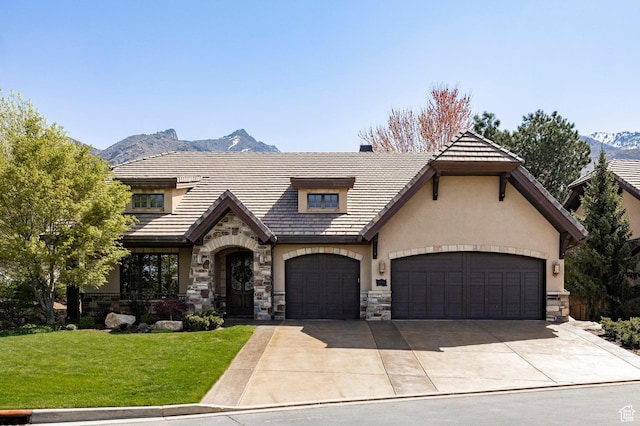 8777 S Falcon Heights Ln E, Cottonwood Heights, UT 84093 - view of front of home featuring a mountain view, stone siding, and stucco siding