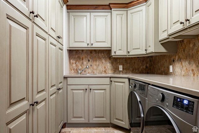 8777 S Falcon Heights Ln E, Cottonwood Heights, UT 84093 - laundry area with cabinet space and washing machine and clothes dryer
