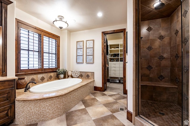 8777 S Falcon Heights Ln E, Cottonwood Heights, UT 84093 - full bathroom with a shower stall, a bath, and a spacious closet