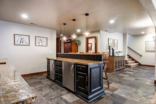 8777 S Falcon Heights Ln E, Cottonwood Heights, UT 84093 - kitchen featuring fridge, a breakfast bar, dark cabinets, baseboards, and visible vents