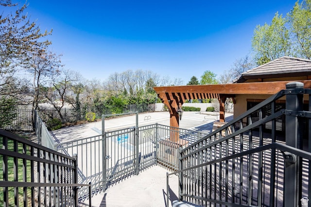8777 S Falcon Heights Ln E, Cottonwood Heights, UT 84093 - wooden terrace featuring a fenced in pool, a patio area, fence, and stairs