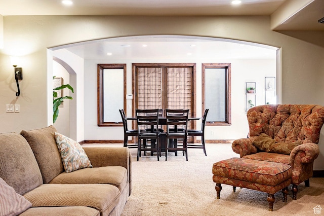 8777 S Falcon Heights Ln E, Cottonwood Heights, UT 84093 - carpeted living room featuring arched walkways, baseboards, and recessed lighting