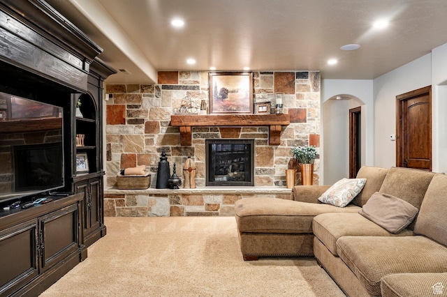 8777 S Falcon Heights Ln E, Cottonwood Heights, UT 84093 - carpeted living area featuring arched walkways, recessed lighting, and a stone fireplace