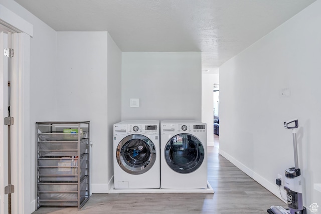 84 W Wasatch St S, Midvale, UT 84047 - clothes washing area with separate washer and dryer, laundry area, baseboards, and wood finished floors