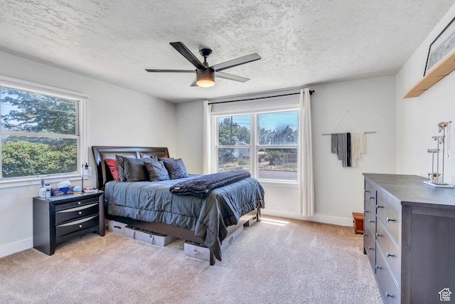 84 W Wasatch St S, Midvale, UT 84047 - bedroom featuring a ceiling fan, baseboards, multiple windows, and light carpet