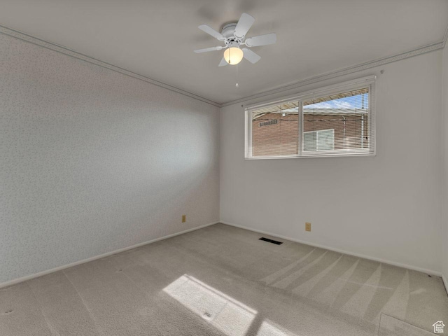 5362 W Elaine Ave, West Valley City, UT 84120 - empty room featuring a ceiling fan, baseboards, light colored carpet, and ornamental molding