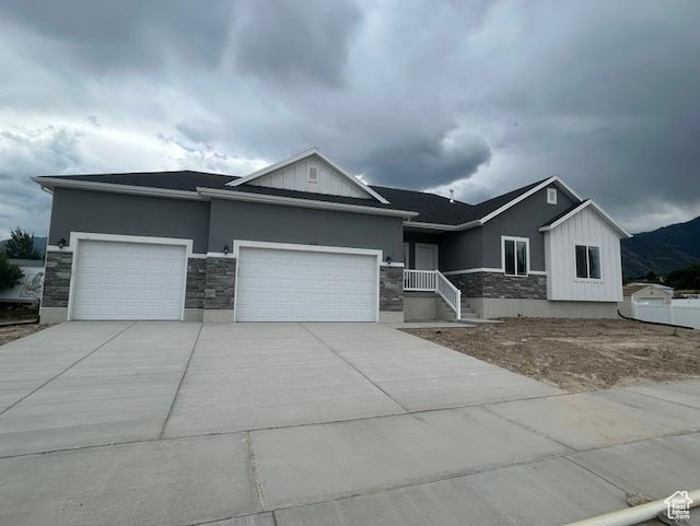 438 N 500 E Lot 2, Salem, UT 84653 - view of front of property featuring stone siding, an attached garage, concrete driveway, and stucco siding