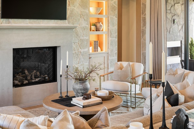 205 W Lazy Acres Ln, Kamas, UT 84036 - living room featuring built in features and a glass covered fireplace