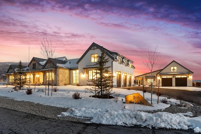 205 W Lazy Acres Ln, Kamas, UT 84036 - back of house at dusk with a standing seam roof, driveway, and metal roof