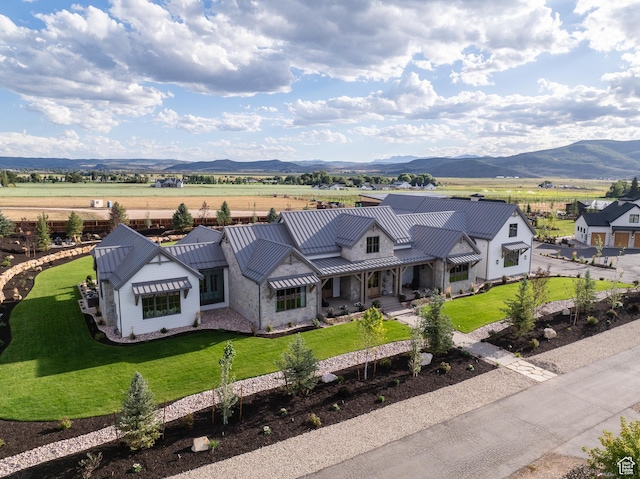 205 W Lazy Acres Ln, Kamas, UT 84036 - view of front of property featuring a standing seam roof, metal roof, a mountain view, and a front yard