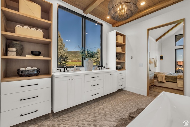 205 W Lazy Acres Ln, Kamas, UT 84036 - interior space featuring an inviting chandelier, lofted ceiling with beams, a sink, and dark carpet