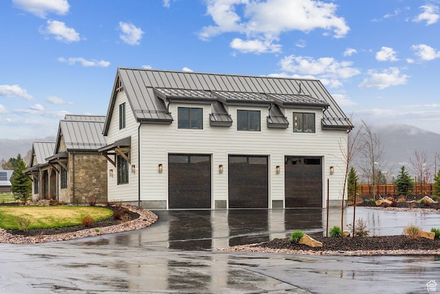 205 W Lazy Acres Ln, Kamas, UT 84036 - exterior space with fence, a standing seam roof, metal roof, an attached garage, and driveway