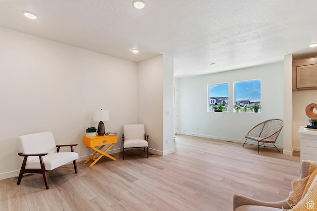 4888 W Coulter Unit 703, Highland, UT 84003 - sitting room featuring light wood-style flooring and recessed lighting
