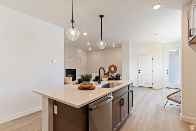 4888 W Coulter Unit 703, Highland, UT 84003 - kitchen featuring stainless steel dishwasher, light wood-type flooring, light countertops, pendant lighting, and recessed lighting