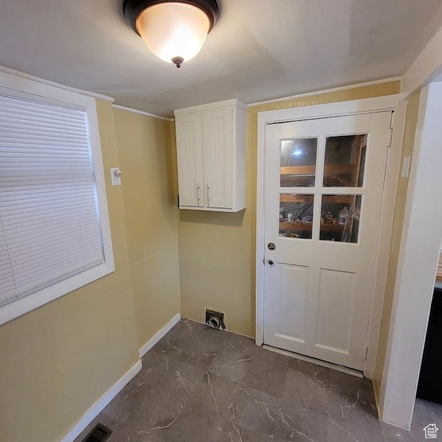 207 N Rawlins St, East Carbon, UT 84520 - clothes washing area featuring cabinet space, baseboards, and marble finish floor