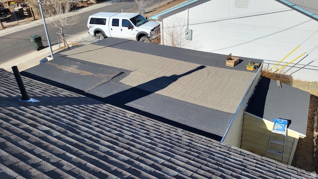 207 N Rawlins St, East Carbon, UT 84520 - details featuring a shingled roof and fence