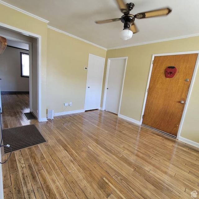 207 N Rawlins St, East Carbon, UT 84520 - interior space featuring light wood-style floors, baseboards, ceiling fan, and ornamental molding