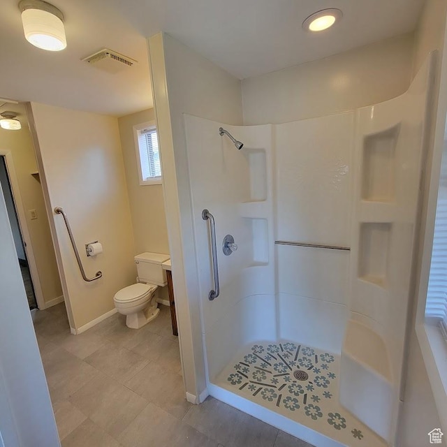 207 N Rawlins St, East Carbon, UT 84520 - bathroom featuring walk in shower, toilet, baseboards, and visible vents