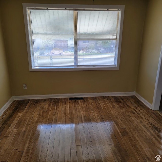 207 N Rawlins St, East Carbon, UT 84520 - spare room with wood-type flooring and baseboards