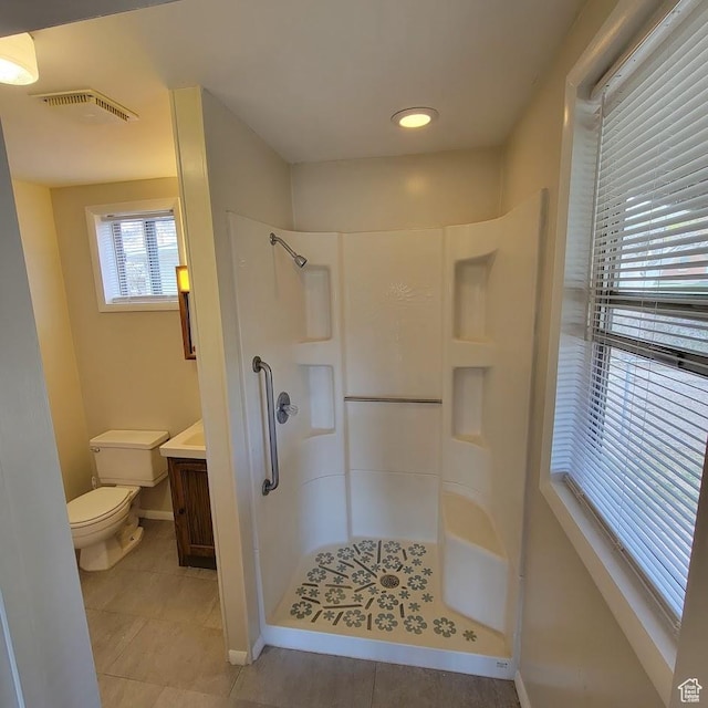 207 N Rawlins St, East Carbon, UT 84520 - full bathroom featuring toilet, walk in shower, and tile patterned flooring