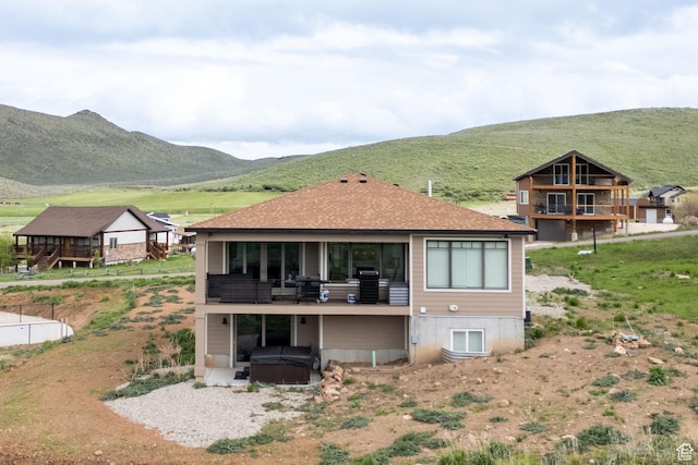 207 E Clubhouse Dr Unit 40, Garden City, UT 84028 - back of property featuring a hot tub and a mountain view
