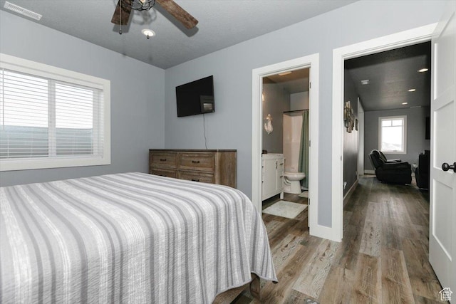 207 E Clubhouse Dr Unit 40, Garden City, UT 84028 - bedroom featuring wood finished floors, baseboards, and ensuite bath