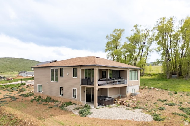 207 E Clubhouse Dr Unit 40, Garden City, UT 84028 - back of property with a hot tub and a balcony