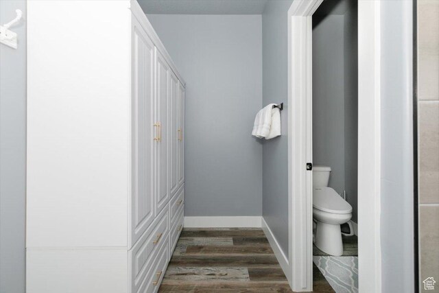 207 E Clubhouse Dr Unit 40, Garden City, UT 84028 - bathroom with wood finished floors, toilet, and baseboards